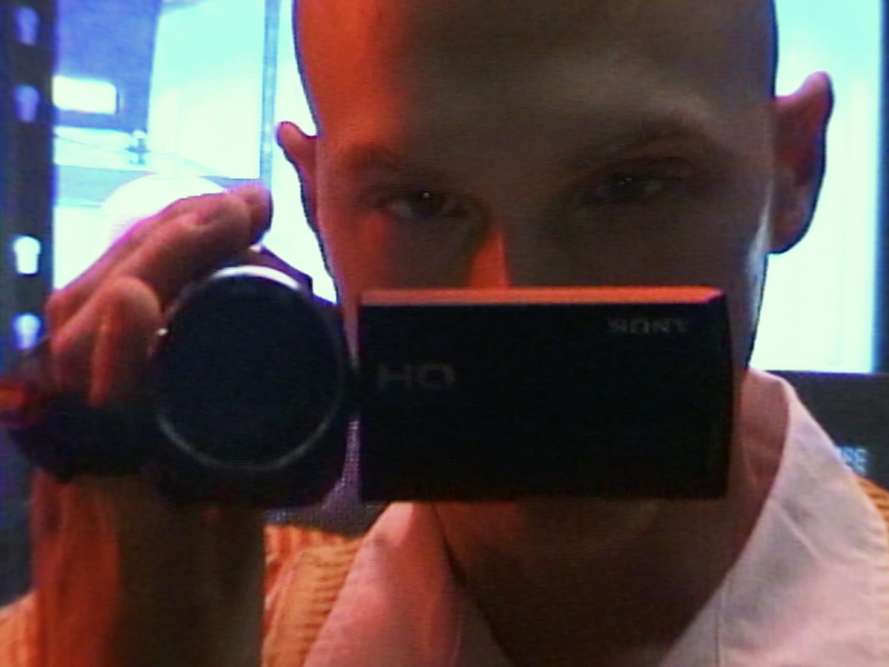Michael films himself with a camcorder
